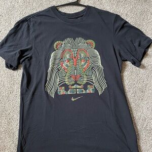 Nike Men's Black Tee with Colorful Lion Design